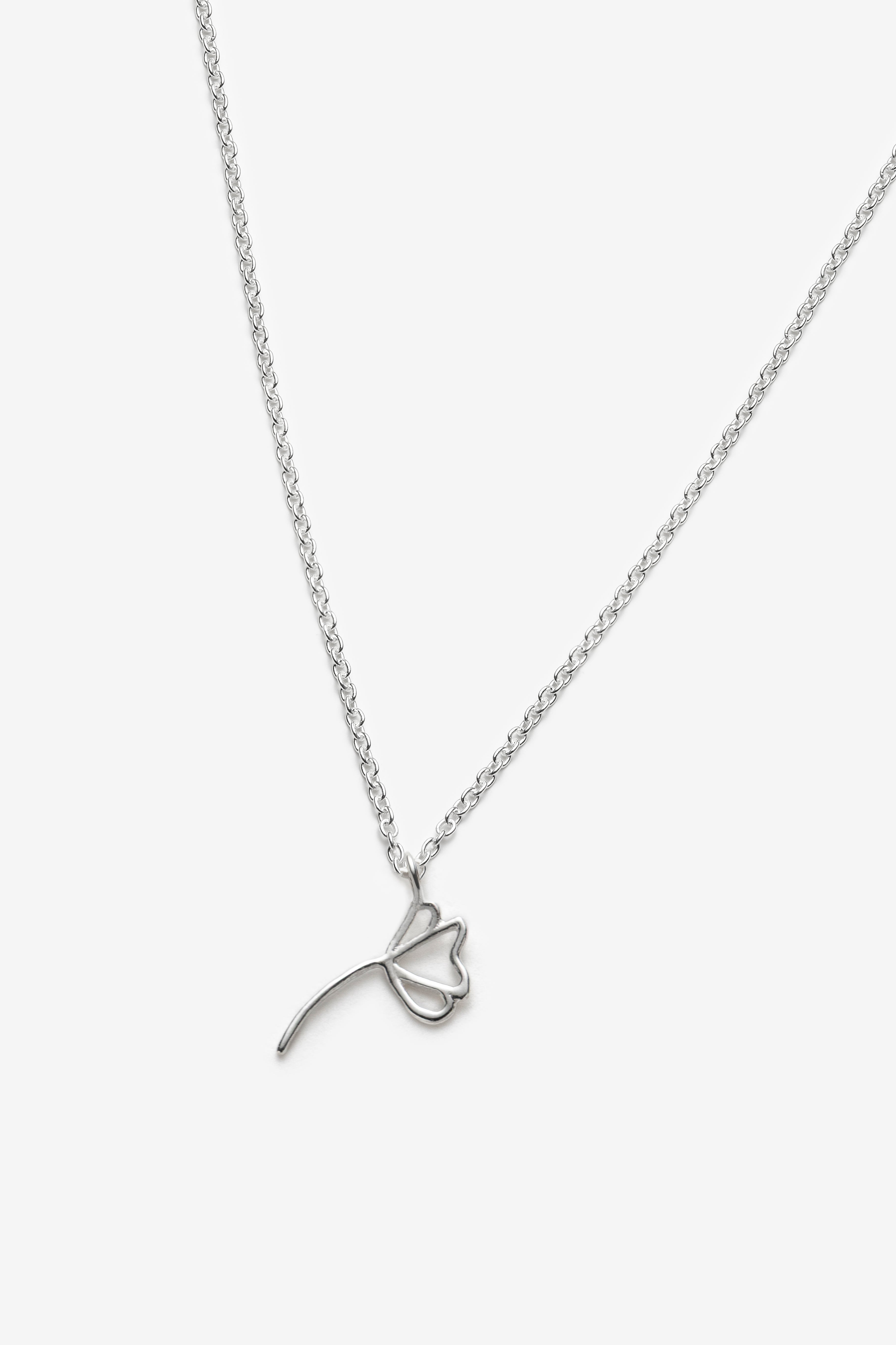 Silver necklace with a sunflower-shaped pendant on a white background